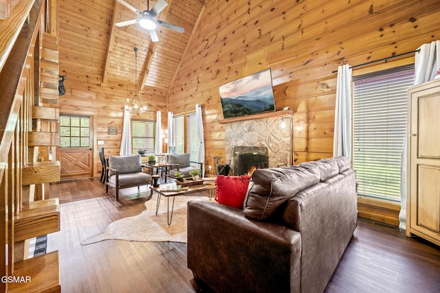 living room featuring beam ceiling, dark hardwood / wood-style flooring, high vaulted ceiling, a fireplace, and wood ceiling