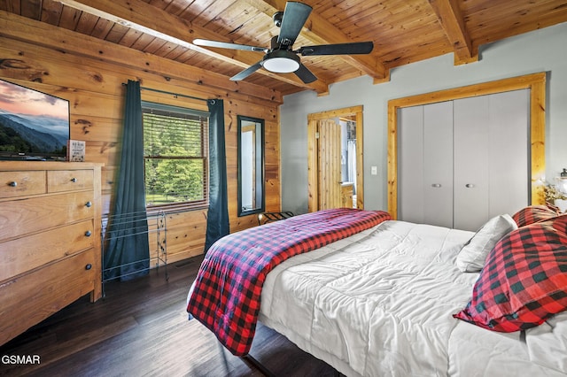 bedroom with beamed ceiling, wood walls, and wood ceiling