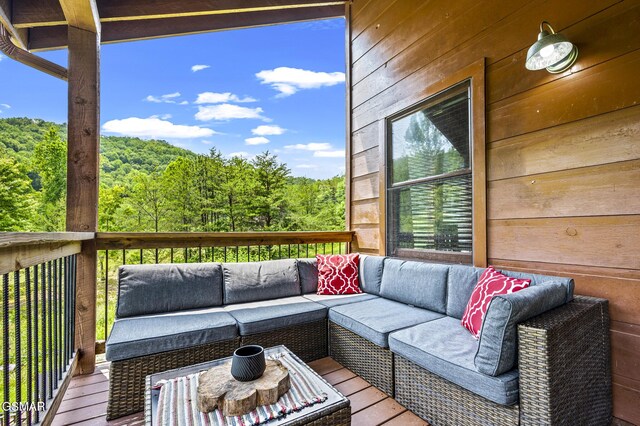 wooden deck featuring outdoor lounge area