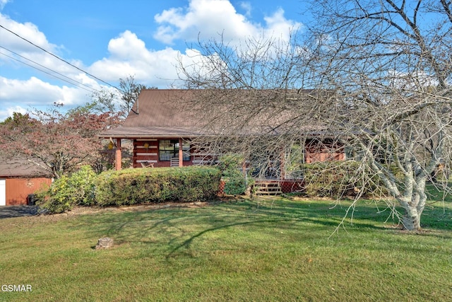 log home featuring a porch and a front yard