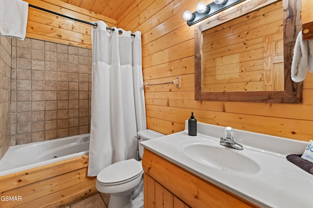 full bathroom featuring vanity, toilet, wooden walls, and shower / bath combo