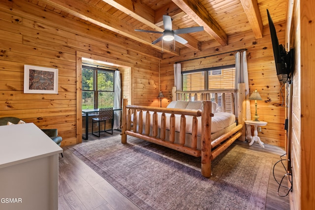 bedroom with wood walls, beamed ceiling, and wooden ceiling