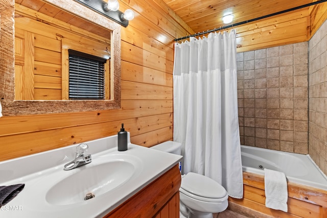 full bathroom featuring toilet, vanity, shower / tub combo, and wooden walls