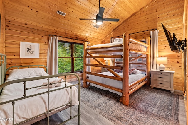 bedroom with ceiling fan, high vaulted ceiling, wooden ceiling, and wood-type flooring