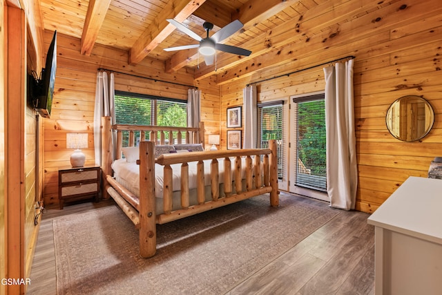 bedroom with wood ceiling, dark hardwood / wood-style flooring, access to exterior, wood walls, and beam ceiling