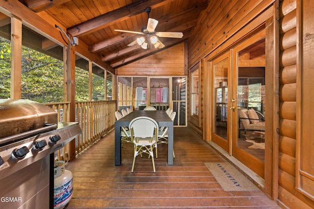 sunroom / solarium featuring wooden ceiling, lofted ceiling with beams, and ceiling fan