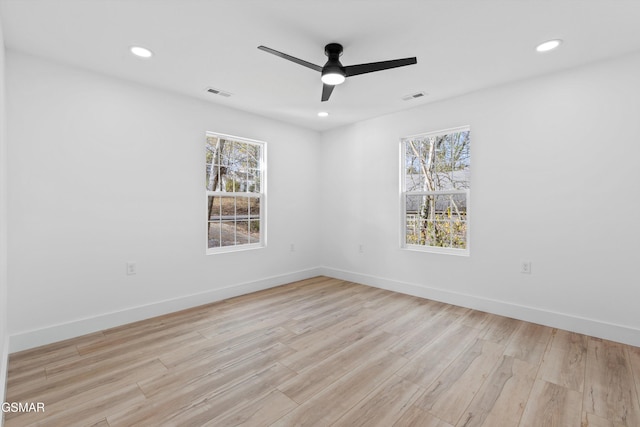 empty room featuring light hardwood / wood-style flooring and ceiling fan