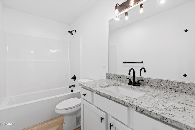 full bathroom featuring shower / tub combination, hardwood / wood-style flooring, vanity, and toilet