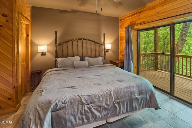 820 Pinnacle Vista Rd, Gatlinburg, TN 37738 - bedroom featuring access to outside, wooden walls, and tile patterned floors