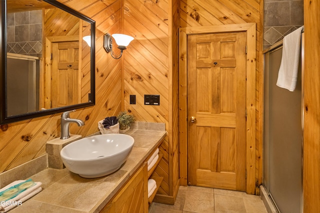 820 Pinnacle Vista Rd, Gatlinburg, TN 37738 - bathroom featuring a stall shower, vanity, wood walls, and tile patterned floors
