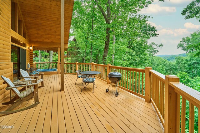 820 Pinnacle Vista Rd, Gatlinburg, TN 37738 - wooden deck with outdoor dining space and area for grilling