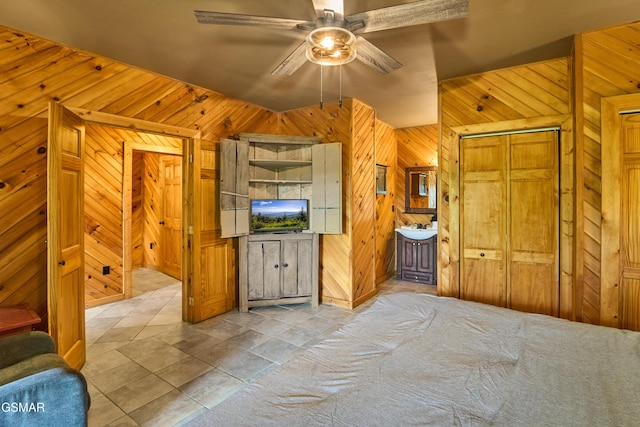 820 Pinnacle Vista Rd, Gatlinburg, TN 37738 - unfurnished bedroom with wood walls, ceiling fan, and tile patterned floors