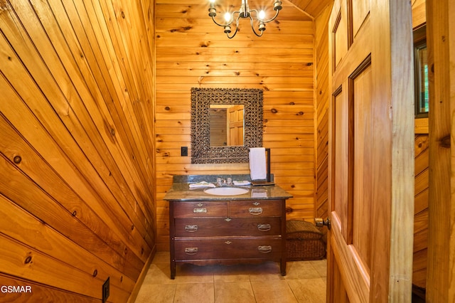 820 Pinnacle Vista Rd, Gatlinburg, TN 37738 - bathroom with vanity, a chandelier, wood walls, and tile patterned floors
