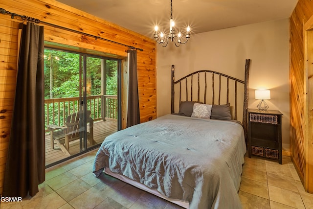 820 Pinnacle Vista Rd, Gatlinburg, TN 37738 - bedroom featuring a chandelier, wood walls, light tile patterned flooring, and access to exterior