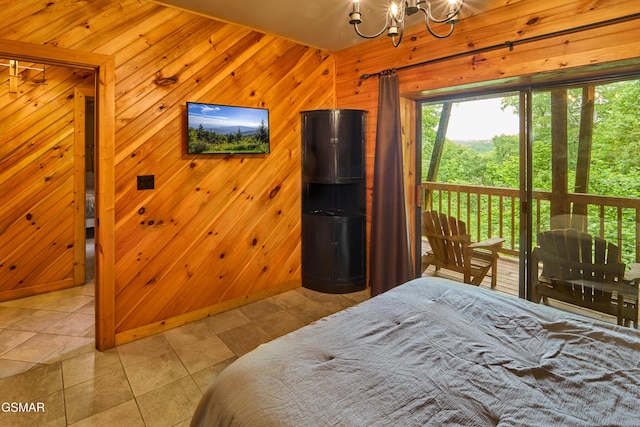 820 Pinnacle Vista Rd, Gatlinburg, TN 37738 - tiled bedroom featuring a chandelier and wooden walls
