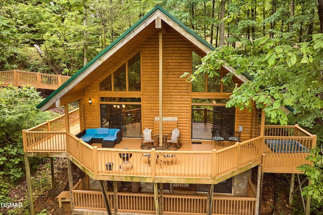 820 Pinnacle Vista Rd, Gatlinburg, TN 37738 - rear view of property with a wooden deck, a forest view, and log veneer siding