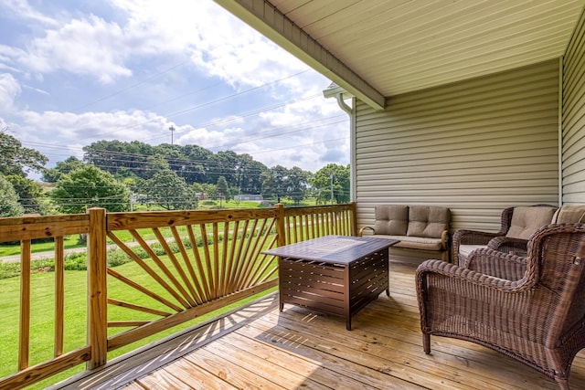 wooden deck featuring a lawn