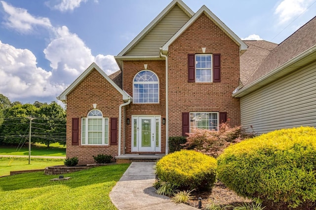 front facade with a front lawn