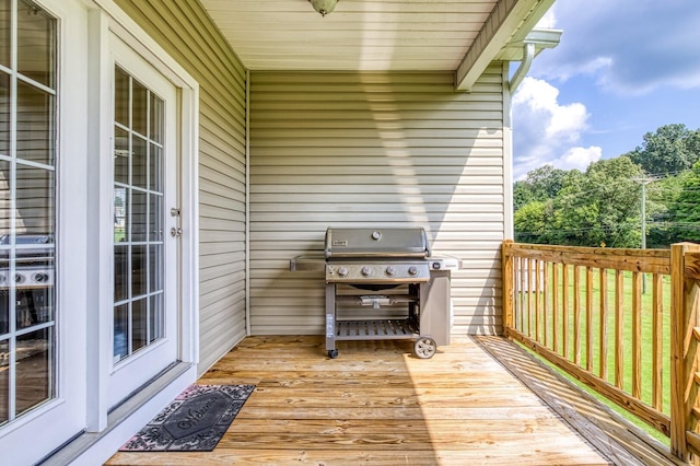 wooden deck featuring area for grilling