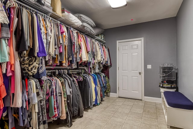 spacious closet featuring light tile patterned floors