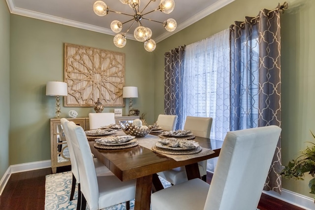 dining area featuring a chandelier and crown molding