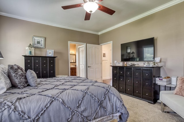 carpeted bedroom with connected bathroom, ceiling fan, and crown molding