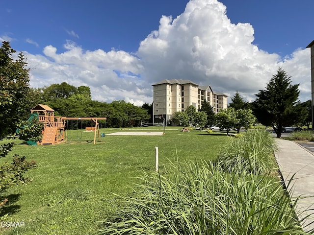 view of property's community with a yard