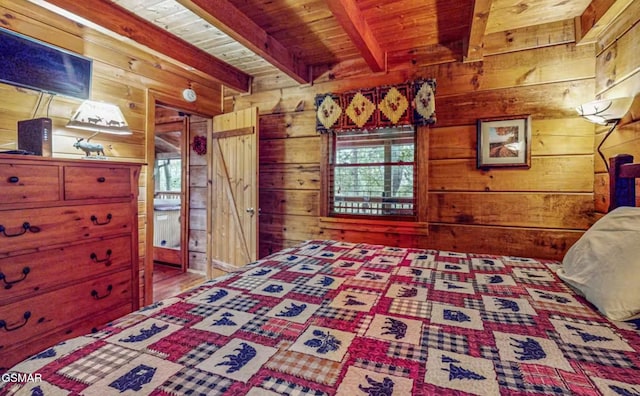 bedroom featuring wooden walls, multiple windows, and wooden ceiling