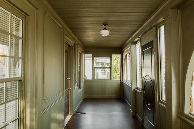 unfurnished sunroom with wooden ceiling