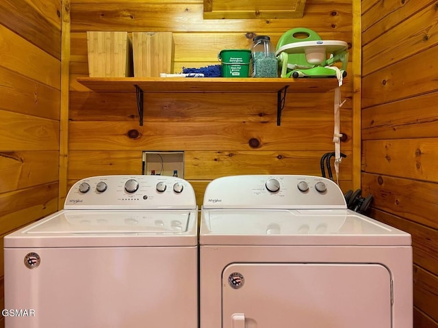 2336 Breezy Rd, Sevierville, TN 37876 - laundry area with washing machine and dryer and wooden walls