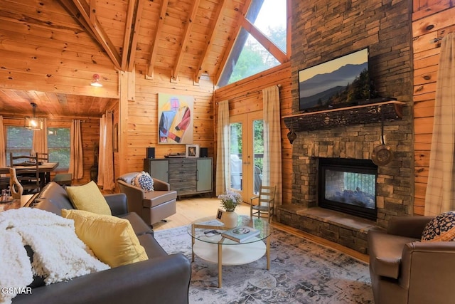 2336 Breezy Rd, Sevierville, TN 37876 - living area with wood finished floors, a wooden ceiling with exposed beams, plenty of natural light, wooden walls, and a stone fireplace