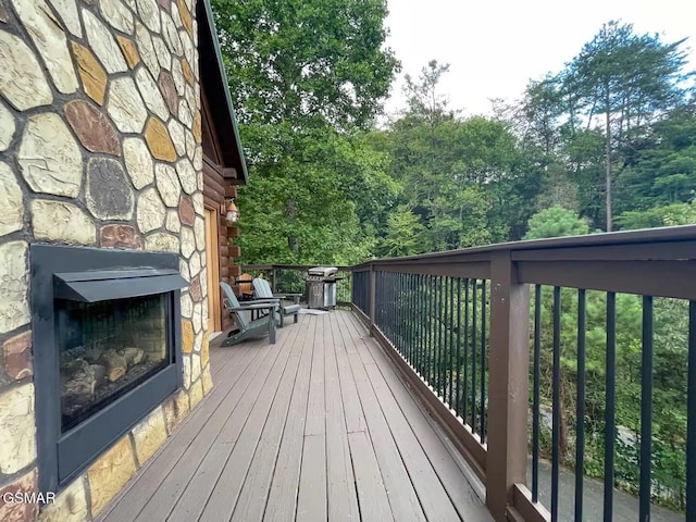 2336 Breezy Rd, Sevierville, TN 37876 - wooden deck with a stone fireplace