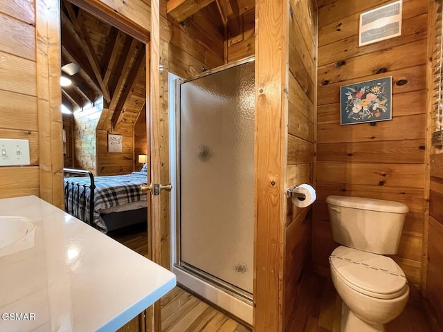 2336 Breezy Rd, Sevierville, TN 37876 - bathroom with wood walls, wood finished floors, a stall shower, vaulted ceiling, and vanity