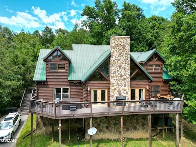 2336 Breezy Rd, Sevierville, TN 37876 - rear view of house featuring french doors, log siding, a wooden deck, and a chimney