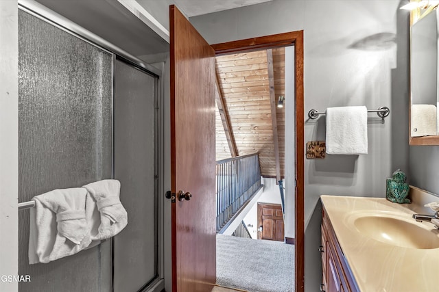 bathroom featuring vanity and a shower stall