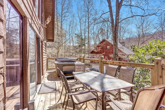 wooden terrace with outdoor dining space