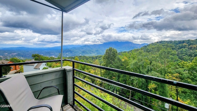 balcony featuring a mountain view