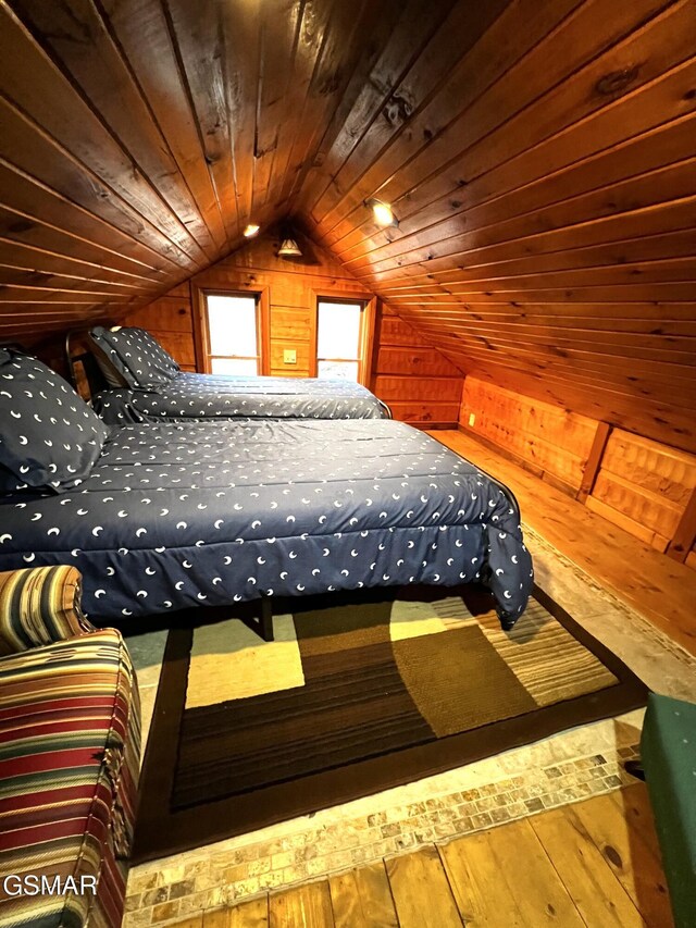 living room featuring wooden ceiling, high vaulted ceiling, wooden walls, a fireplace, and wood-type flooring