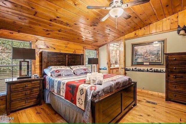 bedroom with ceiling fan, vaulted ceiling, wood ceiling, and light hardwood / wood-style flooring