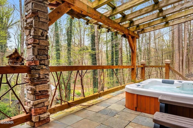 unfurnished sunroom with a hot tub