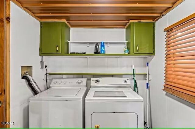 laundry room featuring cabinets and independent washer and dryer