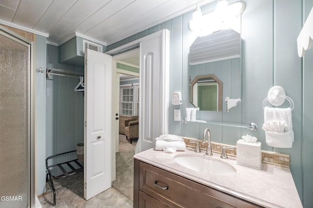 204 Hill St, Gatlinburg, TN 37738 - full bathroom featuring crown molding, vanity, and a shower stall