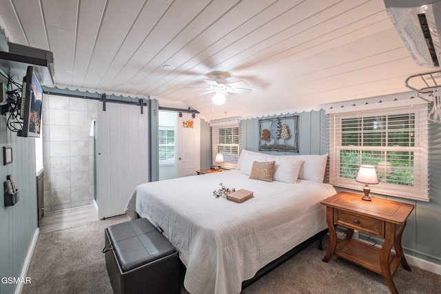 204 Hill St, Gatlinburg, TN 37738 - bedroom featuring a barn door, wooden ceiling, and carpet