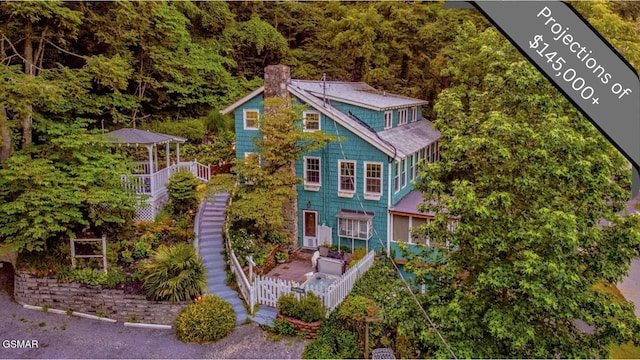 204 Hill St, Gatlinburg, TN 37738 - view of front of property featuring a chimney and stairway