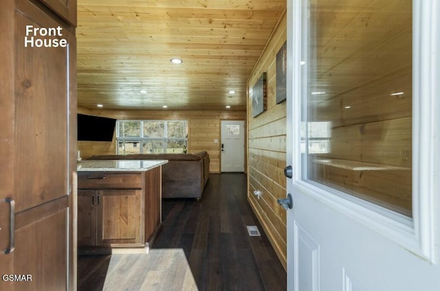 kitchen with recessed lighting, wood ceiling, open floor plan, brown cabinetry, and dark wood finished floors