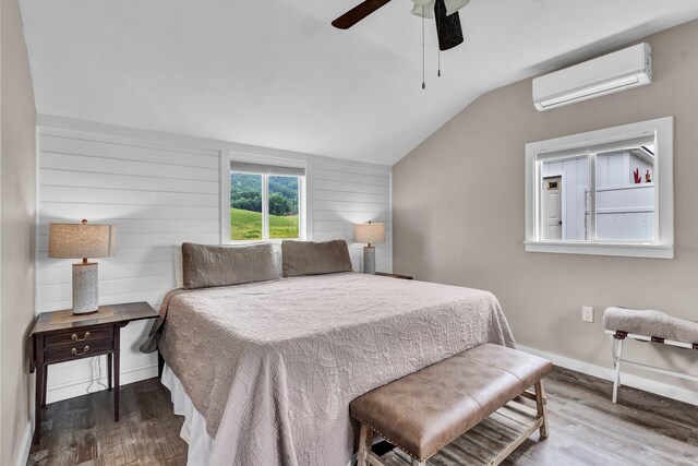 39693975 Wears Valley Rd, Sevierville, TN 37862 - bedroom featuring a wall mounted air conditioner, lofted ceiling, wood finished floors, baseboards, and a ceiling fan