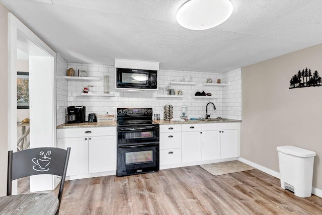 39693975 Wears Valley Rd, Sevierville, TN 37862 - kitchen featuring black appliances, open shelves, a sink, decorative backsplash, and a textured ceiling