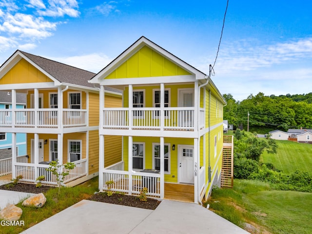 270B W Main St, Dandridge, TN 37725 - townhome / multi-family property with covered porch, board and batten siding, a balcony, and a front yard