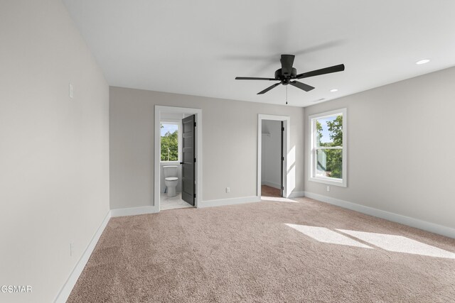 270B W Main St, Dandridge, TN 37725 - unfurnished bedroom with multiple windows, baseboards, and light carpet