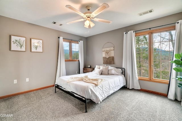 bedroom featuring carpet, visible vents, ceiling fan, and baseboards